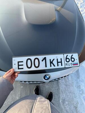 Фотография автомобиля с номером Е001КН 66